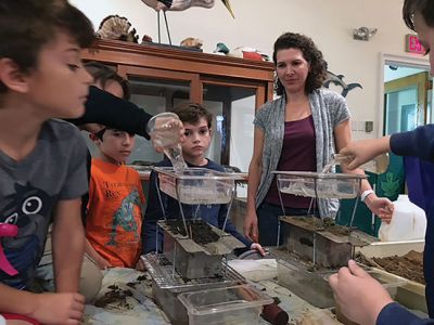 Marion Natural History Museum
On Wednesday, the Marion Natural History Museum's after school group created a soil profile for the museum and took an inventory of the creatures in different types of soils. The students also learned with the use of a rain-simulator that soil that is too well worked will compact, and water will run off the top instead of getting to the roots of plants. 
