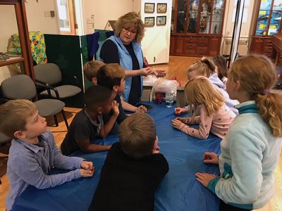 Marion Natural History Museum
The Marion Natural History Museum's afterschool group would like to thank Dawn Gates-Allen of the Cape Cod Cranberry Growers Association for the enjoyable program involving one of Southeastern Massachusetts’ most important crops. We took a close look at the insides of cranberries to discover what makes them float, counted seeds - which tell us how many times a plant was fertilized by a bee – and had a chance to see how far we could "bounce" a berry. Photos courtesy Elizabeth Liedhold
