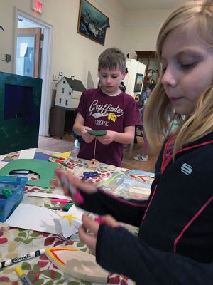 Marion Natural History Museum
One hull or two? On March 11, the Marion Natural History Museum afterschool group explored the physics behind sailboat design. Mark Whalen, engineer with Massachusetts Maritime Academy, introduced several alternative design ideas for constructing our own sailboats. The students explored a variety of hull designs, mast locations and different sizes and shapes of sails. Then they raced the vessels in rain gutters to see which design moved fastest.
