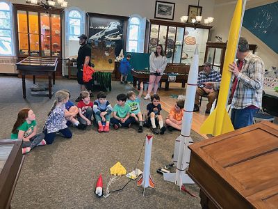 Marion Natural History Museum
The Marion Natural History Museum’s afterschool group had a terrific time constructing their own rockets for launching. This program was so popular it had to be offered twice! The kids had a hands-on introduction to the engineering principles of propulsion and lift. Every rocket managed a successful launch hundreds of feet in the air, and most were safely carried down by the parachutes. The Museum wishes to thank volunteers Mike Cronin and his son Jake for the great program. Photos courtesy Elizabeth Leidho
