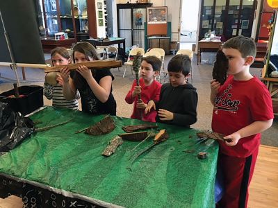 Marion Natural History Museum
The Marion Natural History Museum’s afterschool group had a chance to learn to identify certain local trees in winter by their bark. Students compared red cedar bark to red pine, took a close look at various lichens and mosses that use tree bark as a surface to grow on, and counted rings in a log supplied by Hartley Saw Mill in Rochester. 
