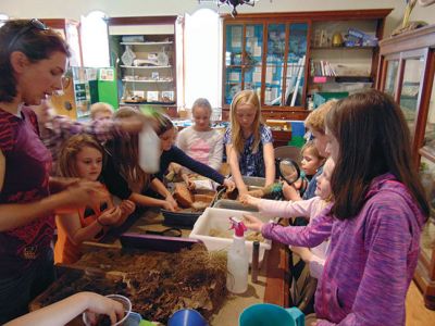 Marion Natural History Museum
The Marion Natural History Museum afterschool group had a chance to explore the soils last Wednesday. Many thanks to soil scientist Maggie Payne of the USDA's Natural Resource and Conservation Service. We learned what makes a "good" soil and why that's important to everyone, from farming to building a house. The students had fun conducting experiments with the soils and had a chance to build their own soil profiles to take home. Photo courtesy of Elizabeth Leidhold
