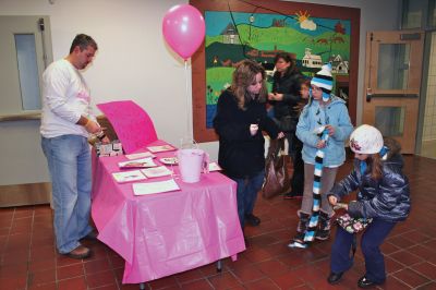 Movie Night
Rochester Memorial School Speech/ Language instructor Darbi Lambert-Matos along with her walking partner Jennifer DaCosta hosted a 'Movie Night' fundraiser at RMS on Friday evening January 20, benefitting the Susan G. Komen for the Cure Fund for the prevention and cure for breast cancer. The night's movie was the Disney feature ‘Snow Buddies’ with the event taking place in the school’s cafetorium. Photo by Robert Chiarito
