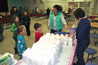 Movie Night
Rochester Memorial School Speech/ Language instructor Darbi Lambert-Matos along with her walking partner Jennifer DaCosta hosted a 'Movie Night' fundraiser at RMS on Friday evening January 20, benefitting the Susan G. Komen for the Cure Fund for the prevention and cure for breast cancer. The night's movie was the Disney feature ‘Snow Buddies’ with the event taking place in the school’s cafetorium. Photo by Robert Chiarito
