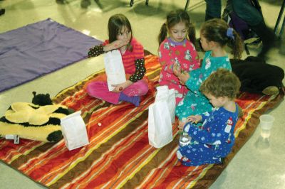 Movie Night
Rochester Memorial School Speech/ Language instructor Darbi Lambert-Matos along with her walking partner Jennifer DaCosta hosted a 'Movie Night' fundraiser at RMS on Friday evening January 20, benefitting the Susan G. Komen for the Cure Fund for the prevention and cure for breast cancer. The night's movie was the Disney feature ‘Snow Buddies’ with the event taking place in the school’s cafetorium. Photo by Robert Chiarito
