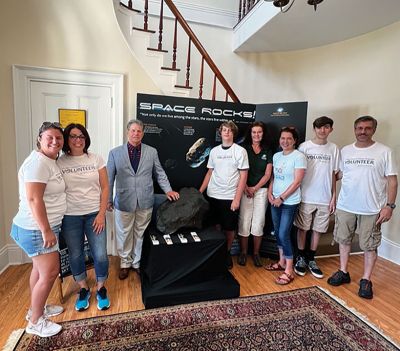 Marion Natural History Museum
Ted and Liz Brainard visit with Coahuila, a 700-pound meteorite, during the June 25 celebration of 150 years of the Marion Natural History Museum and the Elizabeth Taber Library. Select Board Chairman Randy Parker visited with museum volunteers, and children enjoyed a wide range of summer activities. The meteorite, on loan from the Harvard Museum of Natural History, will be in Marion for the next three to five years. Photos courtesy of Elizabeth Leidhold
