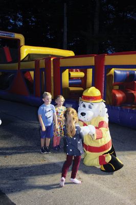 Marion Fire Department 
The Marion Fire Department held an open house on Friday evening. Older children learned how to use fire-extermination equipment, and younger ones enjoyed the bouncy house and a meeting with mascot Sparky. Photos by Mick Colageo
