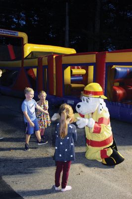 Marion Fire Department 
The Marion Fire Department held an open house on Friday evening. Older children learned how to use fire-extermination equipment, and younger ones enjoyed the bouncy house and a meeting with mascot Sparky. Photos by Mick Colageo
