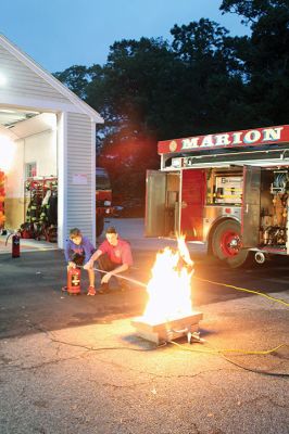 Marion Fire Department 
The Marion Fire Department held an open house on Friday evening. Older children learned how to use fire-extermination equipment, and younger ones enjoyed the bouncy house and a meeting with mascot Sparky. Photos by Mick Colageo
