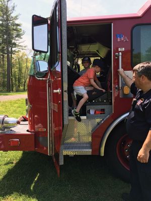 Touched-A-Truck
On Saturday May 21 children crawled into and Touched-A-Truck at Washburn Park in Marion. The event was sponsored by the Marion Recreation Department in partnership with Marion’s Police, Fire and DPW departments. Kids enjoyed freshly popped pop corn and the adjacent playground on a day that beamed with sunlight as bright as the smiles on little faces. Photos by Marilou Newell
