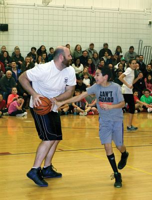 RMS Students vs. Staff Basketball Game
Tough luck again this year for the sixth graders at RMS during the annual students vs. staff basketball game on Friday night. Although students were able to tie the game and gain a temporary slight lead, in the end the staff’s moves took them down, 60-56. Fifth graders, it’s up to you next year! Photos by Deina Zartman
