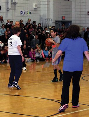 RMS Students vs. Staff Basketball Game
Tough luck again this year for the sixth graders at RMS during the annual students vs. staff basketball game on Friday night. Although students were able to tie the game and gain a temporary slight lead, in the end the staff’s moves took them down, 60-56. Fifth graders, it’s up to you next year! Photos by Deina Zartman
