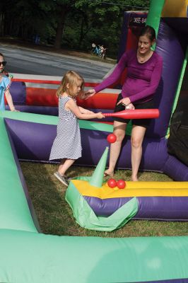 Marion Town Party
Chalk up another successful Marion Town Party as several hundred party-goers found good food and fun on the grounds of the Town House on 8/25. Children of all ages enjoyed inflatable games, climbing the rock wall, or jumping around to music. The annual party has its roots deep in the community and may have started as early at 1900. This year’s event featured live entertainment, a scavenger hunt, and lots of good food. 
