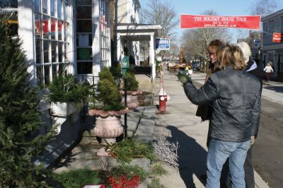 Holiday Dressing
Members from the Marion Garden Club filled Front Street windowboxes with greens, and decorated miniature trees with walnuts and seashells on December 10, 2009. Photo by Anne O'Brien-Kakley.
