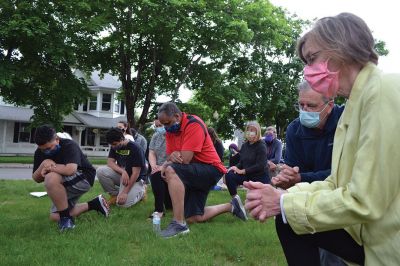 Kneel for Nine
A peaceful crowd gathered on the lawn of the Marion Music Hall on June 2 to kneel in solidarity for nine minutes calling for justice for the death of George Floyd and accountability for police brutality. Marion Police Chief John Garcia dressed in his police uniform was among the roughly 200 kneeling on the grass that afternoon. Photos by Jean Perry
