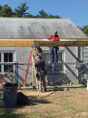 Marion's Cushing Community Center
Junior and senior-year carpentry students from Upper Cape Regional Technical School are building a permanent canopy over the entrance walkway at Marion's Cushing Community Center, formerly the Benjamin Cushing VFW. With the help of the students, the town has been able to fund the materials needed without the associated labor. Previously, Marion residents benefited from the skills of students from UCT when they reconstructed Fire Station 2 located on Point Road. Photos by Marilou Newell
