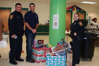 Breakfast with Santa
Marion’s Police Brotherhood held its 3rd annual toy drive and pancake breakfast with Santa at Sippican School on December 6. Families were asked to bring new unwrapped toys, and in return they were given a delicious pancake breakfast and a photo with Santa. The toys are being donated to the Justice Resource Institute, which provides a wide range of services to at-risk families and individuals. Photos by Marilou Newell
