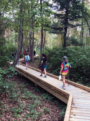 Brownie Girl Scout Troop 
Brownie Girl Scout Troop 67047 hiked the Sippican Land Trust Osprey walk in Marion on Sunday. Ms. Jerline used her Nature Anatomy book to help the girls identify plants.  Ms. Liz and Ms. Alda helped the girls carry a tune as they learned three new songs for their Girl Scout Way badge. Ms. Tia helped remind them to maintain their 6 feet of distance with her yardstick and keep their masks on— they did so well!  We welcomed a new girl from Acushnet.  
