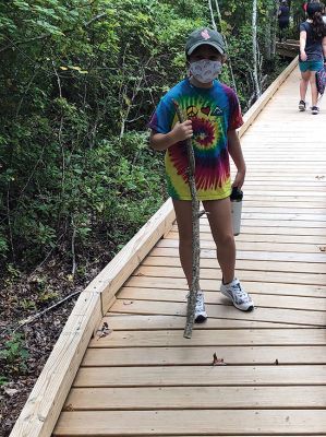 Brownie Girl Scout Troop 
Brownie Girl Scout Troop 67047 hiked the Sippican Land Trust Osprey walk in Marion on Sunday. Ms. Jerline used her Nature Anatomy book to help the girls identify plants.  Ms. Liz and Ms. Alda helped the girls carry a tune as they learned three new songs for their Girl Scout Way badge. Ms. Tia helped remind them to maintain their 6 feet of distance with her yardstick and keep their masks on— they did so well!  We welcomed a new girl from Acushnet.  
