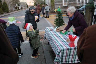 Marion Village Stroll
Cars lined several Marion streets as residents gathered for the town’s Christmas Stroll on December 12. Front Street and connecting village roads were partially closed for the event, as families enjoyed refreshments provided by area merchants at their doorsteps and along the roads. Clydesdale horses escorted Santa Claus and passengers, while the Sippican Elementary School Band played, Tabor Academy student singer Wesley Lai of Hong Kong sang, and a bike rider juggled bowling pins. Photos by Mick Colageo
