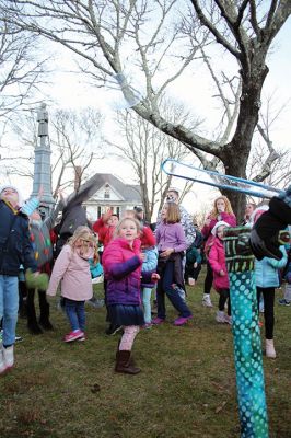 Marion Village Stroll
Cars lined several Marion streets as residents gathered for the town’s Christmas Stroll on December 12. Front Street and connecting village roads were partially closed for the event, as families enjoyed refreshments provided by area merchants at their doorsteps and along the roads. Clydesdale horses escorted Santa Claus and passengers, while the Sippican Elementary School Band played, Tabor Academy student singer Wesley Lai of Hong Kong sang, and a bike rider juggled bowling pins. Photos by Mick Colageo
