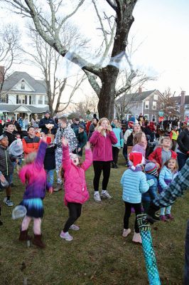 Marion Village Stroll
Cars lined several Marion streets as residents gathered for the town’s Christmas Stroll on December 12. Front Street and connecting village roads were partially closed for the event, as families enjoyed refreshments provided by area merchants at their doorsteps and along the roads. Clydesdale horses escorted Santa Claus and passengers, while the Sippican Elementary School Band played, Tabor Academy student singer Wesley Lai of Hong Kong sang, and a bike rider juggled bowling pins. Photos by Mick Colageo

