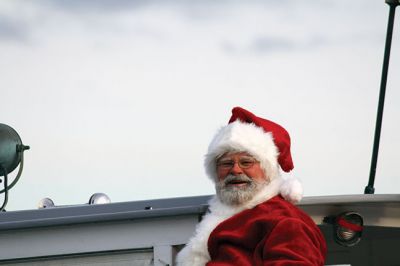 Marion Holiday Stroll 
Here Comes Santa Claus! – Santa made his big entrance to the Marion Holiday Stroll on Sunday, December 8, from across Sippican Harbor on his ‘water sleigh’ to the crowd that awaited him at the Town Wharf. The holiday stroll is the perfect way to get into the holiday spirit and capture a bit of that Christmas magic. Photo by Jean Perry
