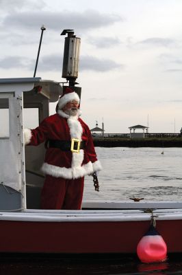 Marion Holiday Stroll 
Here Comes Santa Claus! – Santa made his big entrance to the Marion Holiday Stroll on Sunday, December 8, from across Sippican Harbor on his ‘water sleigh’ to the crowd that awaited him at the Town Wharf. The holiday stroll is the perfect way to get into the holiday spirit and capture a bit of that Christmas magic. Photo by Jean Perry
