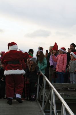 Marion Holiday Stroll 
Here Comes Santa Claus! – Santa made his big entrance to the Marion Holiday Stroll on Sunday, December 8, from across Sippican Harbor on his ‘water sleigh’ to the crowd that awaited him at the Town Wharf. The holiday stroll is the perfect way to get into the holiday spirit and capture a bit of that Christmas magic. Photo by Jean Perry
