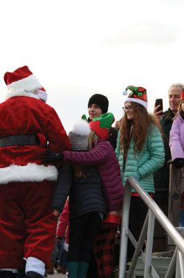 Marion Holiday Stroll 
Here Comes Santa Claus! – Santa made his big entrance to the Marion Holiday Stroll on Sunday, December 8, from across Sippican Harbor on his ‘water sleigh’ to the crowd that awaited him at the Town Wharf. The holiday stroll is the perfect way to get into the holiday spirit and capture a bit of that Christmas magic. Photo by Jean Perry
