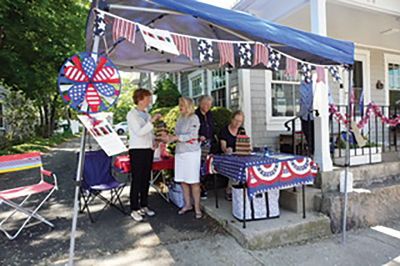 Sippican Woman's Club
Sippican Woman's Club members are seen selling luminaria kits for the Fourth of July celebration. The pop-up sale at the clubhouse, 152 Front Street, is held on Saturdays and Sundays from 10:00 am to 2:00 pm, the proceeds funding Marion student scholarships. The Illuminate to Educate fundraiser replaces the Holiday House Tour that was cancelled due to COVID-19. The Marion community is encouraged to light up our streets in celebration of Independence Day Holiday. 
