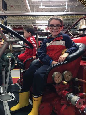 Mattapoisett Fire Department
Throngs of little children and parents enjoyed a fun evening on October 13, as the Mattapoisett Fire Department held its first Fire Prevention Month event in the new Fire Station on Route 6. Children enjoyed clamoring over and into several pieces of apparatus and taking pictures with Sparky the Fire Dog (aka Firefighter David Stewart.) Young and old alike learned at-home, fire-prevention techniques, including hands-on training for use of fire extinguishers. Select Board member Jodi Bauer said, “What little 
