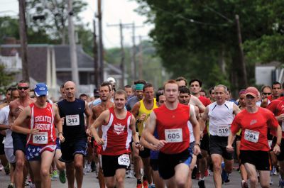 Mattapoisett Road Race
On Wednesday, July 4, over 1,000 runners braved the rain to participate in the Annual Mattapoisett Road Race.  All money raised from the 5-mile race will benefit graduating students from Old Rochester Regional High School.  Photo by Felix Perez.
