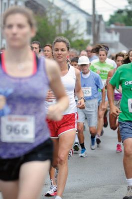 Mattapoisett Road Race
On Wednesday, July 4, over 1,000 runners braved the rain to participate in the Annual Mattapoisett Road Race.  All money raised from the 5-mile race will benefit graduating students from Old Rochester Regional High School.  Photo by Felix Perez.
