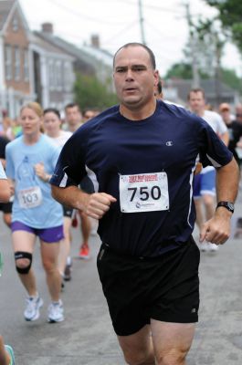 Mattapoisett Road Race
On Wednesday, July 4, over 1,000 runners braved the rain to participate in the Annual Mattapoisett Road Race.  All money raised from the 5-mile race will benefit graduating students from Old Rochester Regional High School.  Photo by Felix Perez.
