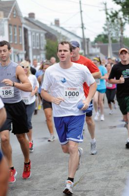 Mattapoisett Road Race
On Wednesday, July 4, over 1,000 runners braved the rain to participate in the Annual Mattapoisett Road Race.  All money raised from the 5-mile race will benefit graduating students from Old Rochester Regional High School.  Photo by Felix Perez.
