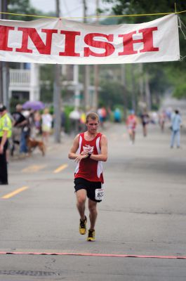 Mattapoisett Road Race
On Wednesday, July 4, over 1,000 runners braved the rain to participate in the Annual Mattapoisett Road Race.  All money raised from the 5-mile race will benefit graduating students from Old Rochester Regional High School.  Photo by Felix Perez.
