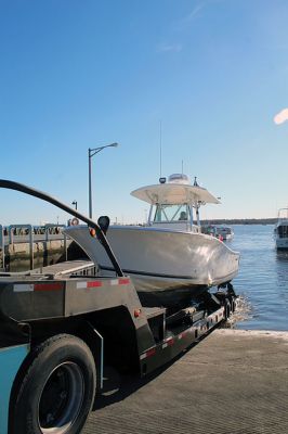 Many of boats of varying shapes and sizes were hauled out of Mattapoisett Harbor last weekend, including center-console models with outboard motors and sailboats. This Mattapoisett-based, J/80 sailboat came out of the water to reveal tiny shrimp crawling on its rudder. Photos by Mick Colageo
