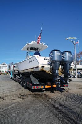 Boats
Many of boats of varying shapes and sizes were hauled out of Mattapoisett Harbor last weekend, including center-console models with outboard motors and sailboats. This Mattapoisett-based, J/80 sailboat came out of the water to reveal tiny shrimp crawling on its rudder. Photos by Mick Colageo
