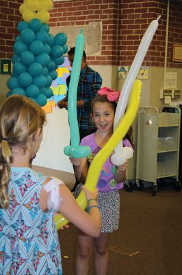 Balloon Fun
The Mattapoisett Library welcomed the balloon-bending artist Chip Rascal to help kick off the library’s summer reading program. Rascal used balloons to create a small-scale replica of Salty the Seahorse, and he also shared his tricks of the trade with library patrons to explore balloon art. Photos by Jean Perry
