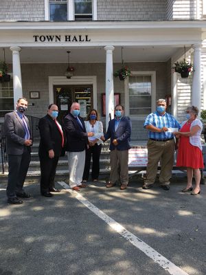 Plymouth County CARES Act
On August 10, Mattapoisett received two checks totaling $185,229 from the Plymouth County CARES Act, a fund established to help cities and towns offset unplanned expenses due to COVID-19. Presenting the checks were Plymouth County commissioners Sandra Wright and Gregory Hanley, along with Thomas O’Brien, the county treasurer, and Jim Cantwell, the state director. Receiving the monies were Mattapoisett’s Town Administrator Mike Lorenco and Selectman John DeCosta, as well as the town’s accountant, Heidi Chuck
