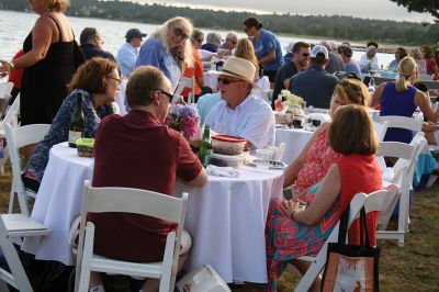 An Affair to Remember 
The Great Community Picnic on August 3 brought 345 residents out to the Munro Preserve in Mattapoisett to enjoy a late afternoon gathering hosted by the Mattapoisett Land Trust and the Historical Society. Along with great food and great wine, guests also arranged some great table centerpieces for their tables. Photos by Jean Perry
