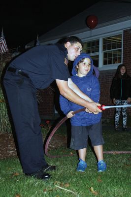 Mattapoisett Fire Department Open House
Thursday, October 13 was the Annual Mattapoisett Fire Department Open House at the fire station. During open house, families can tour the station, enjoy refreshments, make crafts, try out the fire hose, and watch demonstrations such as the Jaws of Life extraction and the much-anticipated fire extinguishing event. Photos by Jean Perry
