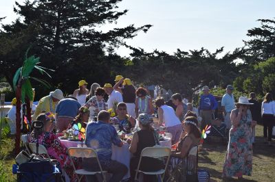 The Great Community Picnic 
Mattapoisett Museum and the Mattapoisett Land Trust held The Great Community Picnic on Thursday, August 7 at Munro Preserve on the water. Tickets were sold out and the venue was filled up. Oysters were served alongside beer and whatever food the over 20 different tables decided to bring. As with previous years, the table with the best theme won the night, that being Table 5 with their Disney theme. Photo by Sam Bishop

