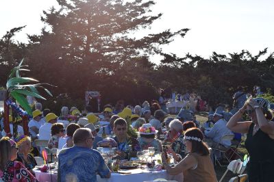 The Great Community Picnic 
Mattapoisett Museum and the Mattapoisett Land Trust held The Great Community Picnic on Thursday, August 7 at Munro Preserve on the water. Tickets were sold out and the venue was filled up. Oysters were served alongside beer and whatever food the over 20 different tables decided to bring. As with previous years, the table with the best theme won the night, that being Table 5 with their Disney theme. Photo by Sam Bishop
