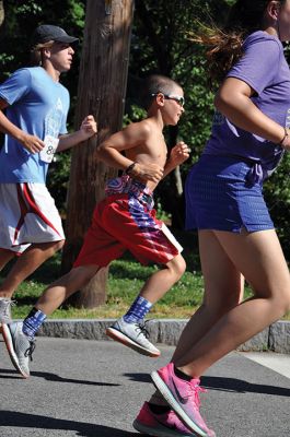 Race to the Finish 
July 4th morning in Mattapoisett means its time for the annual Mattapoisett July 4th Road Race, a five-miler that starts and finishes at Shipyard Park. The proceeds fund scholarships to ORR graduates. Photos by Sarah French Storer
