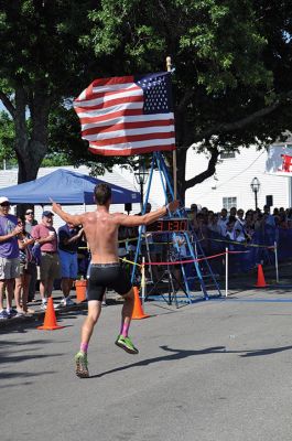 Race to the Finish 
July 4th morning in Mattapoisett means its time for the annual Mattapoisett July 4th Road Race, a five-miler that starts and finishes at Shipyard Park. The proceeds fund scholarships to ORR graduates. Photos by Sarah French Storer
