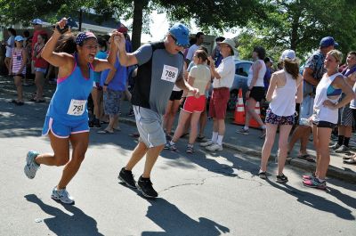 Race to the Finish 
July 4th morning in Mattapoisett means its time for the annual Mattapoisett July 4th Road Race, a five-miler that starts and finishes at Shipyard Park. The proceeds fund scholarships to ORR graduates. Photos by Sarah French Storer
