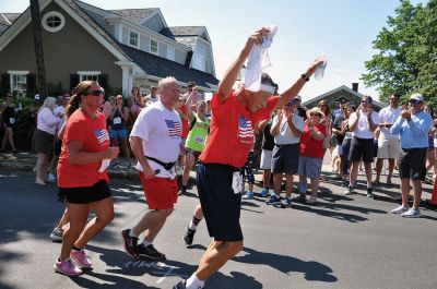 Race to the Finish 
July 4th morning in Mattapoisett means its time for the annual Mattapoisett July 4th Road Race, a five-miler that starts and finishes at Shipyard Park. The proceeds fund scholarships to ORR graduates. Photos by Sarah French Storer
