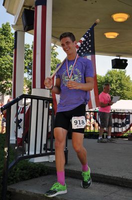 Race to the Finish 
July 4th morning in Mattapoisett means its time for the annual Mattapoisett July 4th Road Race, a five-miler that starts and finishes at Shipyard Park. The proceeds fund scholarships to ORR graduates. Photos by Sarah French Storer
